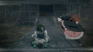 Nezuko kicks the Temple Demon's head off.