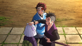 Tanjiro stopping Genya from manhandling Kanata.png