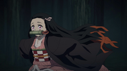 Nezuko running from Kanao.