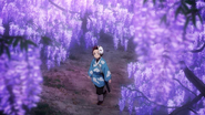 Tanjiro walking among the Wisterias.