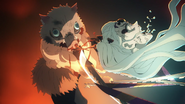 Daki's neck is pierced by Inosuke's blades.