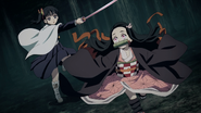 Nezuko getting smaller to dodge Kanao's attack.