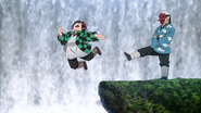 Sakonji kicking Tanjiro off a cliff.