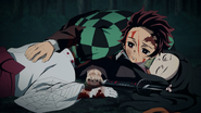 Tanjiro placing his hands on dying Rui