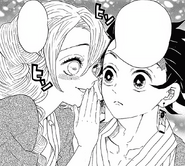 Mitsuri whispering to Tanjiro to find the secret weapon.