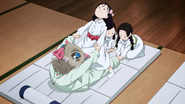Sumi, Kiyo and Naho stretching Inosuke.