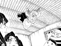 Inosuke appears on the ceiling above Tanjiro