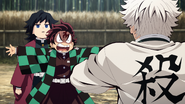Tanjiro pleading for Sanemi to stop fighting Giyu.