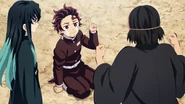 Muichiro looks down at a demoralized Tanjiro.