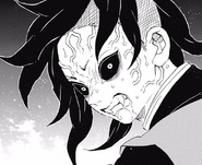 Genya's demonfied face.