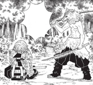 Inosuke attacking Zenitsu