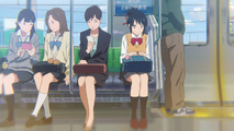 Mitsuha on the train, on her way to meet Taki.