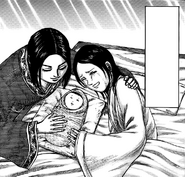 Ei Sei and Kou holding their daughter Rei for the first time.