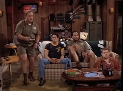 Doug and the guys watching TV in the basement
