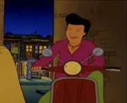 Young Kahn on his cherry moped