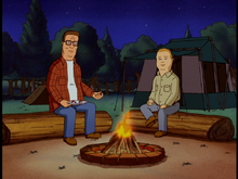 Hank and Bobby by the campfire.