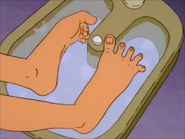 Peggy lifts her Feet out of the Foot bath