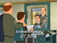 Bill finishes cutting the Captain's hair