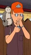 Dale with an opossum on his shoulder in "Hank's Bully".