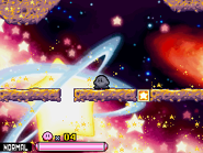 Kirby travels through space on an asteroid.