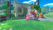 Kirby absorbiendo a un enemigo grande.