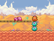 !1Stactus 3.png (13 KB) An orange Stactus atop a pair of teal Stacti.