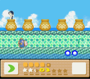 Kirby and Kine play Elieel's minigame in Kirby's Dream Land 3.