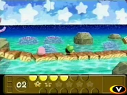 Kirby overlooking the sea in an early pre-release pic.