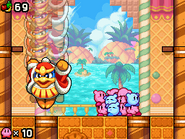 The boss, King Dedede, stomps down.