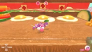 Kirby rolls towards bouncy egg yolks.