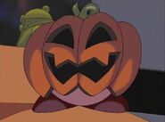 Kirby wearing a pumpkin that bears a slight resemblance to Mr. P. Umpkin