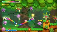 Kirby navigates through a forest of spike balls.