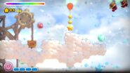 Kirby bounces on the clouds.