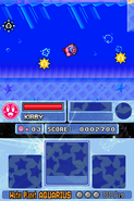 Kirby swims past Gordos. (Kirby Super Star Ultra)