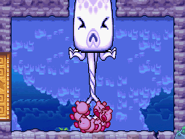 The Kirbys yank Squpi out of the its passage.