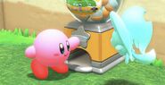 Kirby turns the crank.