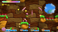 Kirby adventuring with three other Bandana Waddle Dees.