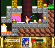 Beam Kirby solves a puzzle with switches. (Kirby Super Star)