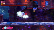 Enemies, here a Driblee and a Poppy Bros. Jr., drop from the ceiling as Kirby approaches.