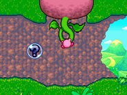 A Kirby tugs on a turnip. (Stage 1)