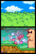 Kirbys luchando contra Whispy Woods.