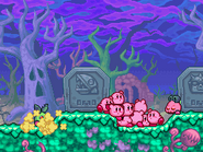 The Kirbys stand near King Eelongo's gravestone in the cemetery.