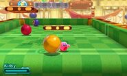 Kirby dodges large billiard balls.