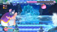 Kirby battling the boss of Onion Ocean, Fatty Puffer.