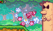 The Kirbys fighting Whispy Woods.