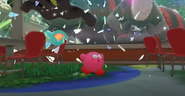 Kirby runs away from the gorilla-like boss.