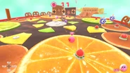 Enemies floating above the fruit platforms must be avoided.