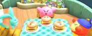 Kirby, Bandana Waddle Dee, and Elfilin prepare to chow down on Kirby Burgers.