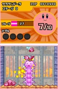 Varios Kirby luchando contra un gran enemigo.