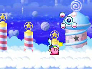 Kirby vanquishes Kracko Jr. in the clouds.